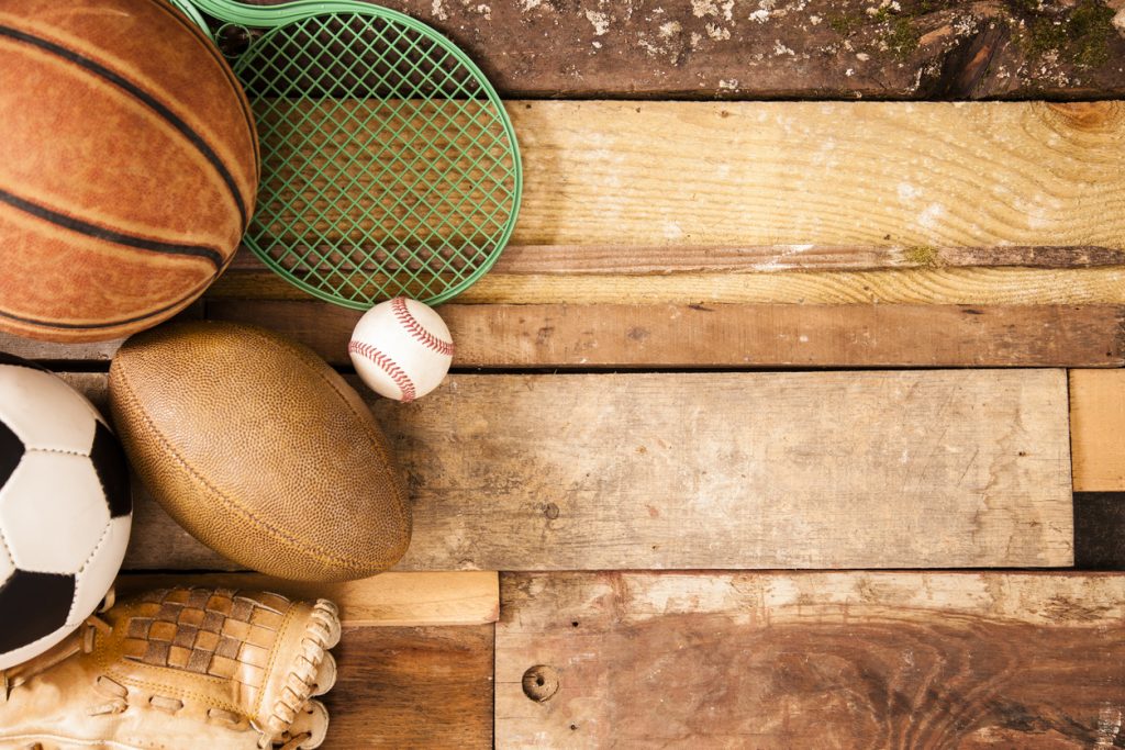 Sports Background: Equipment on unique wooden boards background.