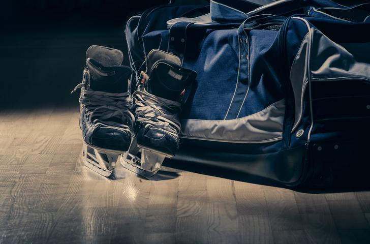Hockey equipment left on the floor
