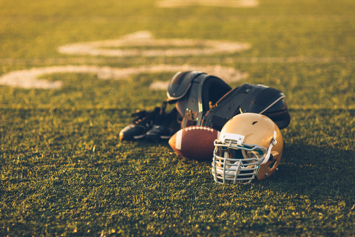 Gold Football Helmet on Field
