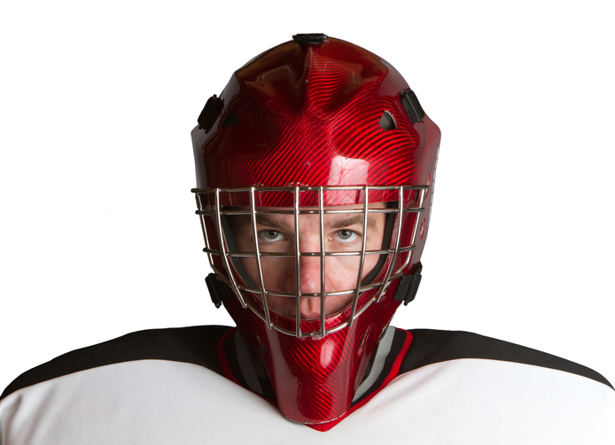 Goalie staring ahead inhelmet
