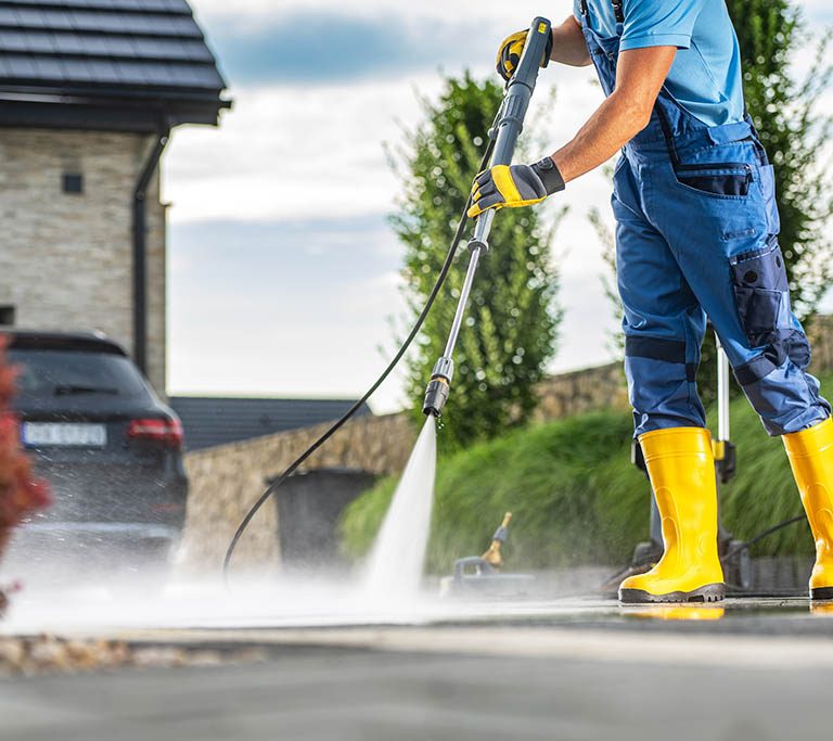 Powerful Pressure Washer Using to Clean Dirty Driveway